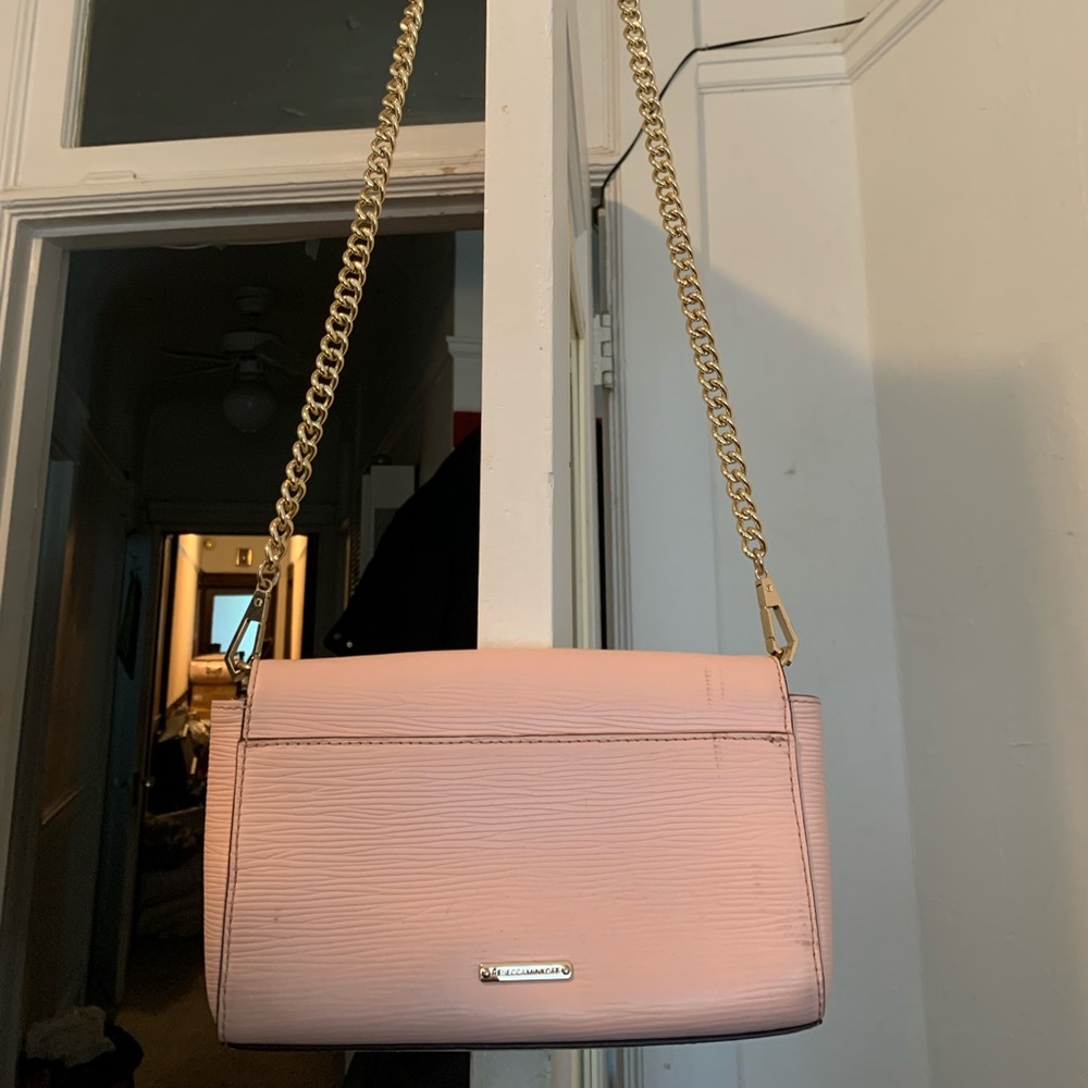 Pale pink Rebecca Minkoff crossbody purse.